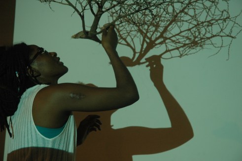 Malaika setting up and experimenting with shadows and filming