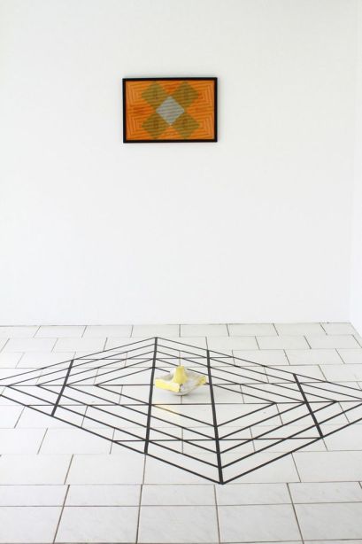 Mark King’s Installation with breeze block configuration and project flag. 